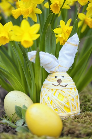 cute floral decoration with little  Easter egg outdoors in gardenの写真素材