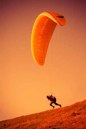 Paraglider flying at Zar Mountain Bielskoの写真素材
