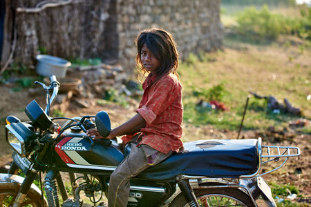 Unidentified indian woman on a motorcycle.のeditorial素材