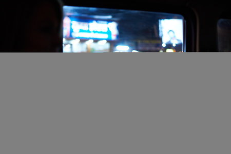 Blurred image of a street food stall in the city at nightのeditorial素材