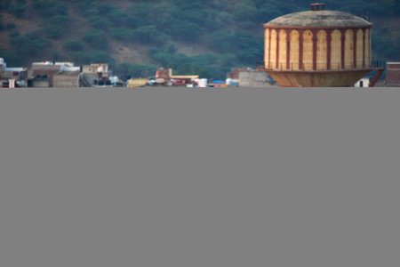 Water tank on the background of the city. View from above.