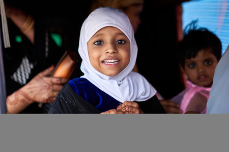 Portrait of a happy little muslim girl smiling in the mosque