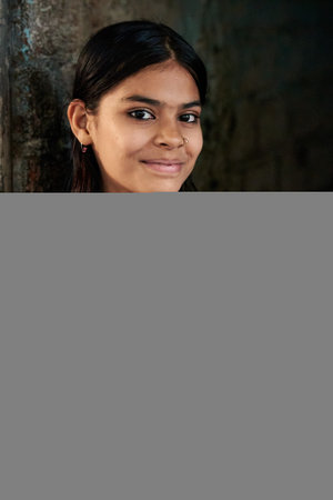 Portrait of a beautiful young woman smiling and looking at camera.