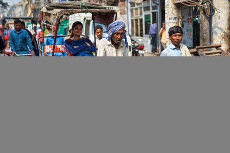 View of unknowns Nepali people walking in the street at Chhetrapati square in Kathmandu in the...