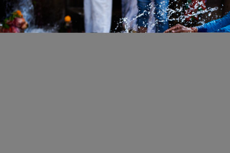 Close-up of a group of people drinking water from a fountain