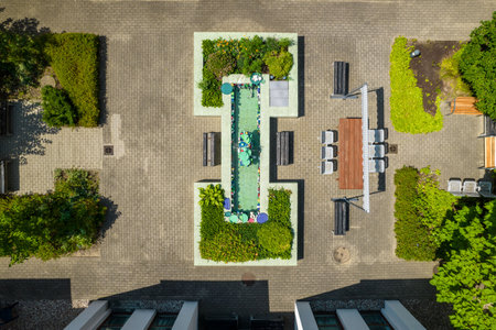 Aerial view of a swimming pool in the garden. Top view.の写真素材