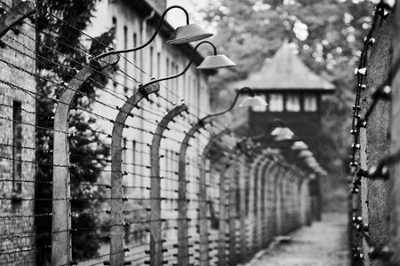 Black and white photo of a metal fence in the old town.