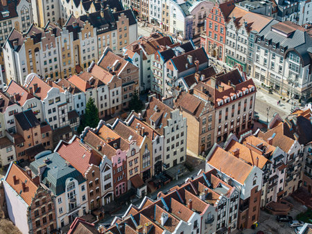 Dense grouping of narrow colorful townhouses in ElblÄg Old Town from aboveの写真素材