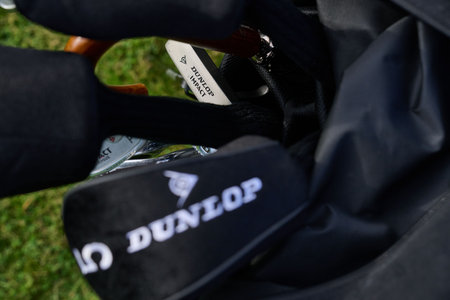 Golf clubs and bag on the golf course in the summer.のeditorial素材