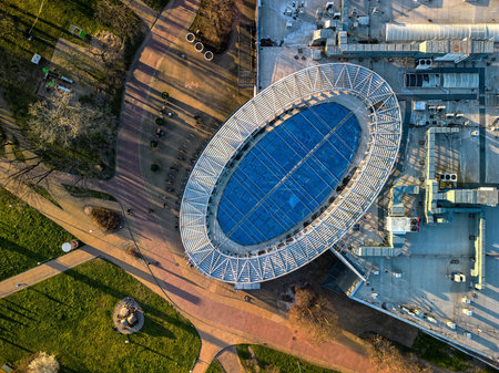 Aerial sunset drone shot of Przymorze rooftop at golden hour, top-down high-angle architecture compositionの写真素材