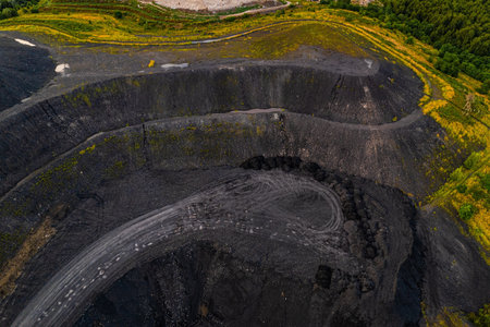 Coal mining dump aerial view red freight train Rybnik Poland industrial landscape black heap...