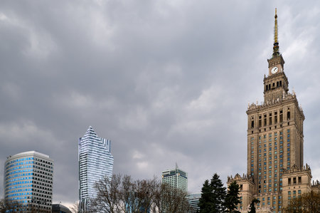 Warsaw skyline with Palace of Culture and Science, modern skyscrapers, overcast daylight, horizontal...