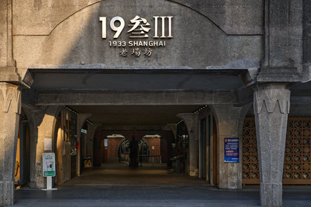 Minimalist underground warehouse space with decorative circle ventilation patterns and lightingのeditorial素材