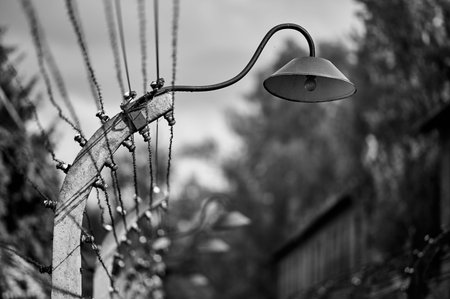 Street lamp and electrified barbed wire fence at Auschwitz