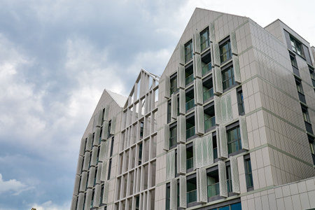 Low angle view of the modern architectural facade of a contemporary apartment complex on Granary...