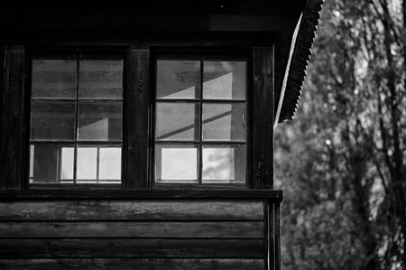 Close-up of windows on a wooden watchtower at Auschwitz.