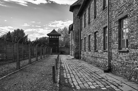 Concentration camp watchtower and electrified barbed wire fence