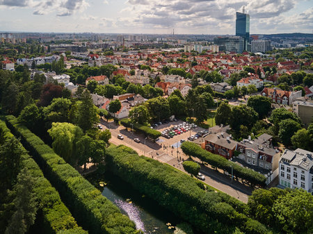 Aerial cityscape featuring the Oliva Star skyscraper and the green residential district of Oliwa...