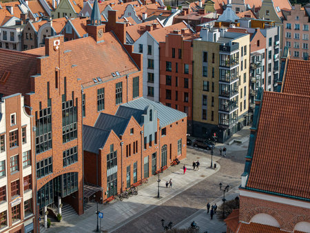 Modern-style gabled townhouses with brick and stucco finishes in ElblÄ…g