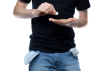 Man counts the last money out of his pocketsの写真素材
