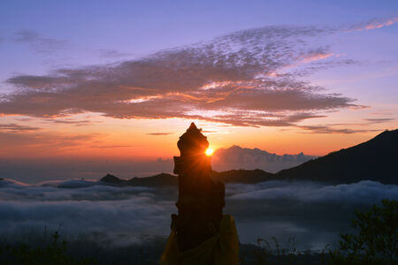 Top of a volcano temple at sunriseの写真素材