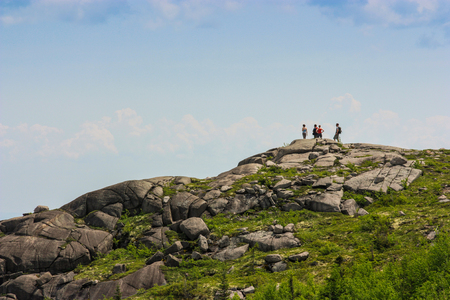 group of hikers going on top of parc des grands-jardinsの写真素材