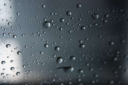 water drops dripping on a windowの写真素材