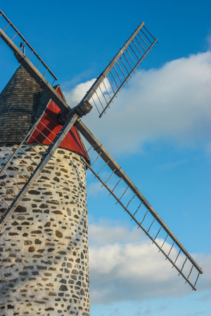 old windmill on blue skyの写真素材