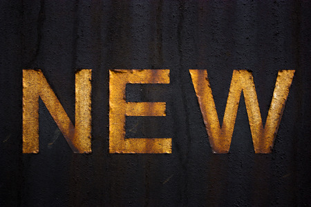 dirty sign with the word NEW on itの写真素材