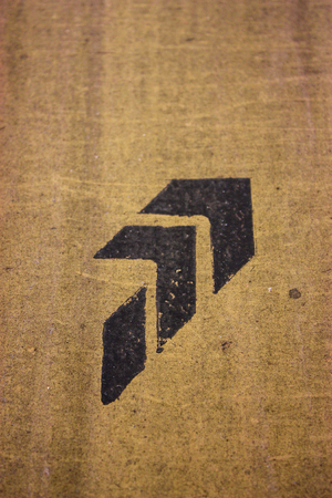 black sign on brown wallの写真素材