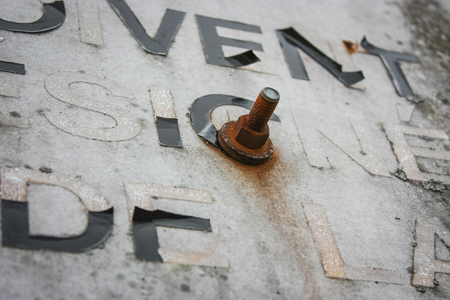 old letters peeling off a wallの写真素材