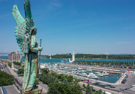 angel statue atop the Notre Dame de Bon Secours Chapel in Old Montreal, Quebec.のeditorial素材