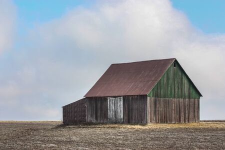 old barn in a fieldの写真素材