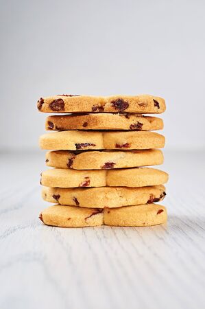 Dried-Cranberry Shortbread Hearts on a White Wooden Tableの写真素材