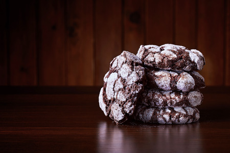 Chocolate crackles cookies on a wooden tableの写真素材