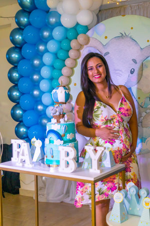 Young mom at her baby's welcome home celebrationの写真素材