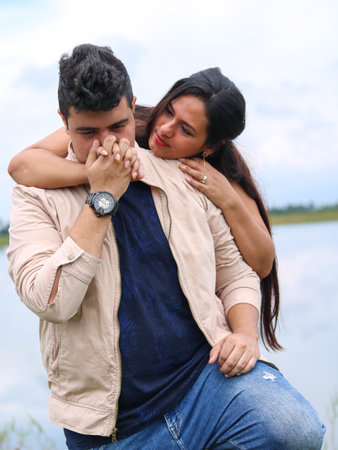 Man kissing his partner's handの写真素材