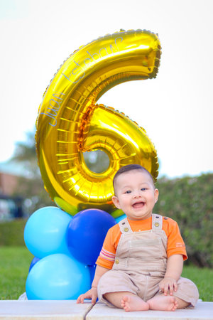 Baby smiling, celebrating his 6 months of lifeの写真素材