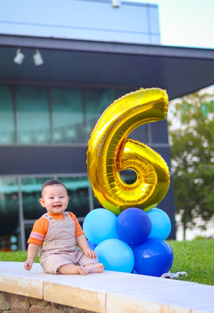 Baby smiling, celebrating his 6 months of lifeの写真素材