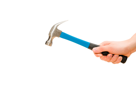 Hand holds blue hammer in action. Isolated, white backgroundの写真素材