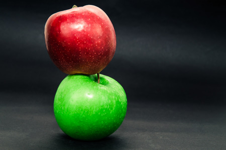 Green and red apple, fresh and healthy on dark backgroundの写真素材