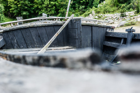 View on the inside of old rusty wooden boatの写真素材