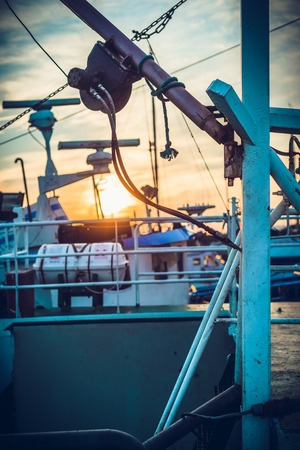Harbor and docks. View on parked boats, sails, sea with great nice sunsetの写真素材