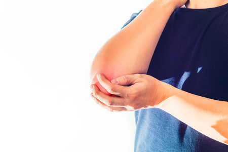 Elbow pain. The man holds his elbow with a hand. Injury, health problems, hand bending problem. White background.の写真素材