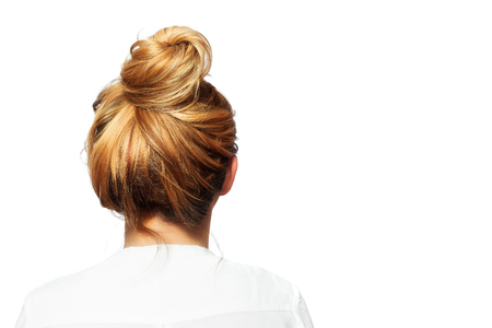 Rear view of a woman and her blond hair.の写真素材