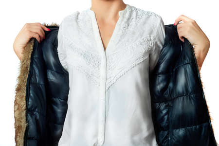 Fashion look on woman. Woman wearing a brown fur jacket and a white shirt.の写真素材