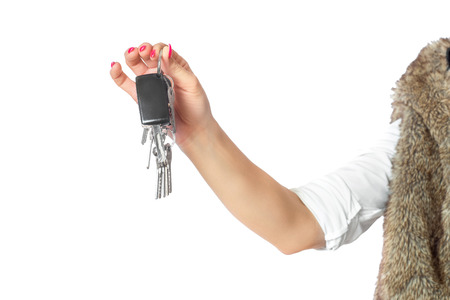 Keys in the hands of a woman.の写真素材