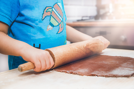 Baking gingerbreads. The family is preparing a gingerbread.の写真素材