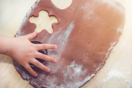Baking gingerbreads. The family is preparing a gingerbread.の写真素材