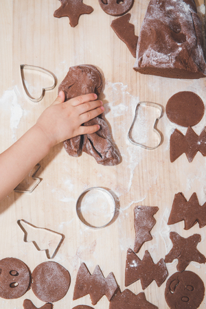 Baking gingerbreads. The family is preparing a gingerbread.の写真素材